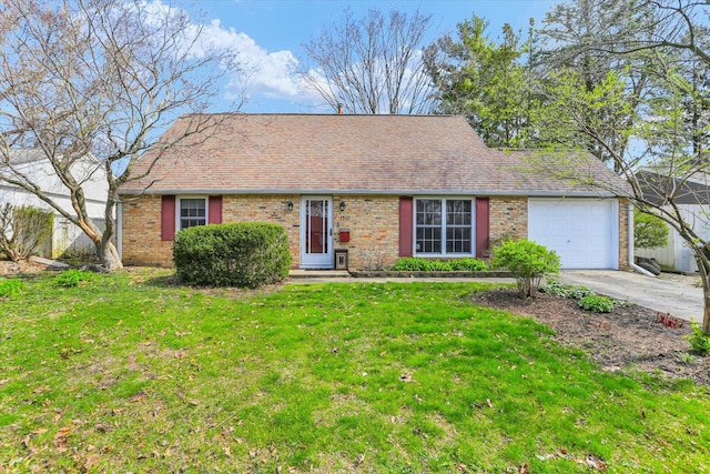 1510 Rutledge Dr, Urbana, IL 61802 - view of front facade with concrete driveway, an attached garage, a front lawn, and brick siding