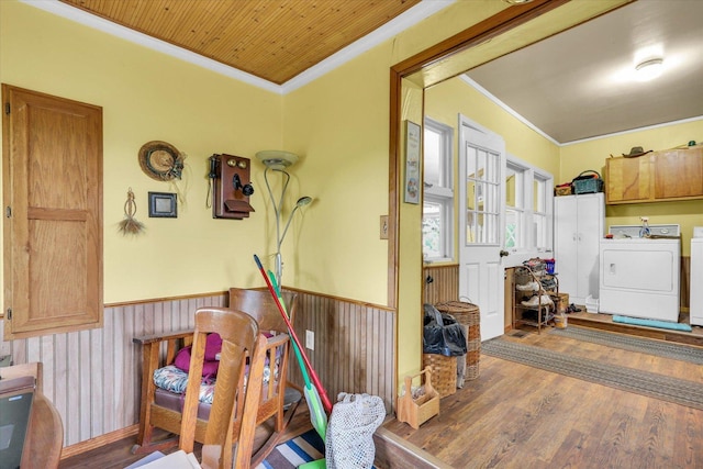 2385 County Road 1550, Saint Joseph, IL 61873 - interior space featuring ornamental molding, washer and clothes dryer, wood finished floors, wainscoting, and wood walls