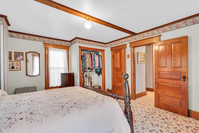 2385 County Road 1550, Saint Joseph, IL 61873 - carpeted bedroom with a closet, beamed ceiling, and baseboards