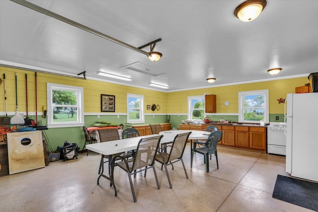 2385 County Road 1550, Saint Joseph, IL 61873 - dining room with healthy amount of natural light, concrete floors, and ornamental molding