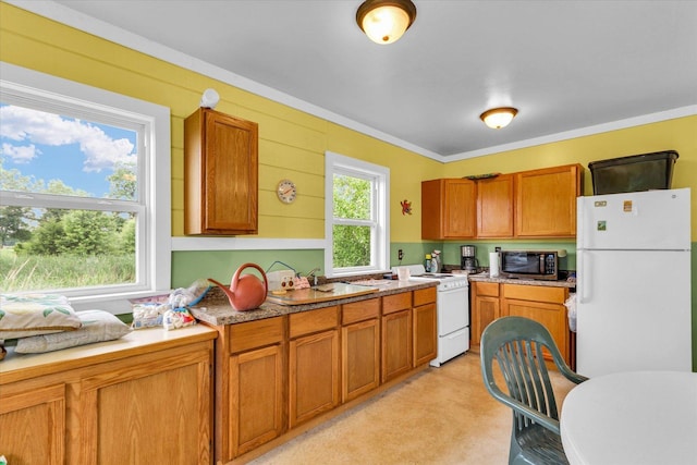 2385 County Road 1550, Saint Joseph, IL 61873 - kitchen featuring white appliances, brown cabinetry, light countertops, and ornamental molding