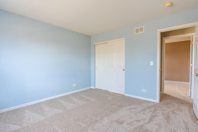 2197 Wilson Creek Cir, Aurora, IL 60503 - unfurnished bedroom featuring carpet floors, baseboards, and a closet