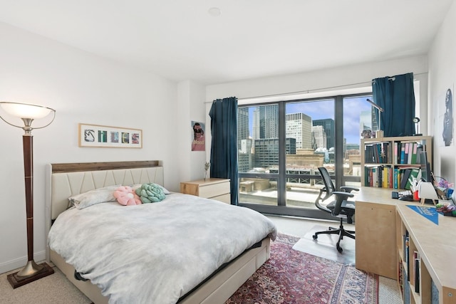 130 N Garland Ct Unit 2406, Chicago, IL 60602 - bedroom featuring a view of city, a desk, and light carpet
