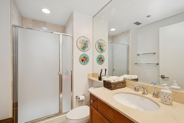 130 N Garland Ct Unit 2406, Chicago, IL 60602 - bathroom featuring vanity, toilet, a shower stall, and recessed lighting