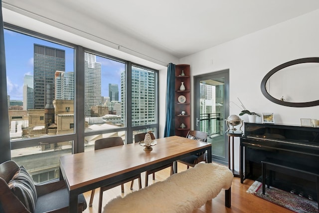 130 N Garland Ct Unit 2406, Chicago, IL 60602 - dining room featuring wood finished floors and a view of city