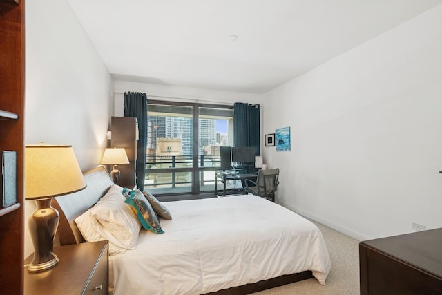 130 N Garland Ct Unit 2406, Chicago, IL 60602 - bedroom with baseboards, carpet, and access to outside