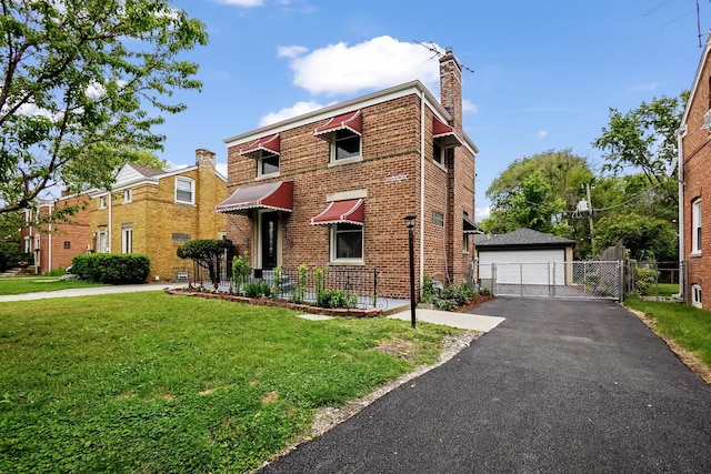 2640 Westbrook Dr, Franklin Park, IL 60131 - view of front of home with an outbuilding, a gate, a detached garage, a chimney, and brick siding