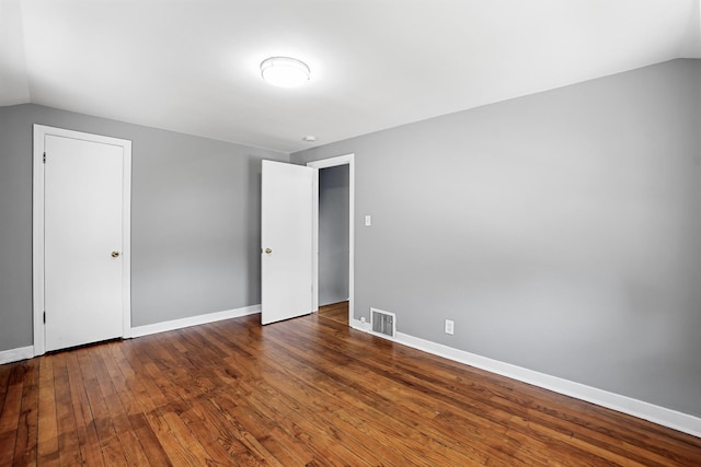 2640 Westbrook Dr, Franklin Park, IL 60131 - unfurnished bedroom featuring vaulted ceiling and wood finished floors