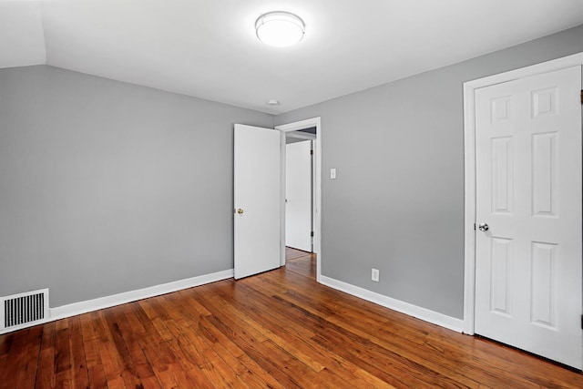 2640 Westbrook Dr, Franklin Park, IL 60131 - unfurnished bedroom featuring wood finished floors and baseboards