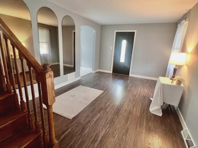 2640 Westbrook Dr, Franklin Park, IL 60131 - entryway with arched walkways, dark wood finished floors, and stairs