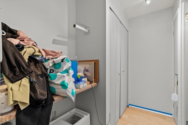 4343 N Clarendon Ave Unit 1301, Chicago, IL 60613 - laundry area featuring wood finished floors