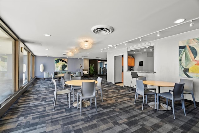 4343 N Clarendon Ave Unit 1301, Chicago, IL 60613 - dining area featuring dark carpet and track lighting