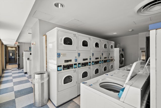 4343 N Clarendon Ave Unit 1301, Chicago, IL 60613 - community laundry room featuring stacked washer and clothes dryer, washer and clothes dryer, light flooring, and attic access