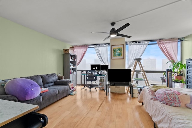 4343 N Clarendon Ave Unit 1301, Chicago, IL 60613 - living room with a ceiling fan, wood finished floors, floor to ceiling windows, and a desk