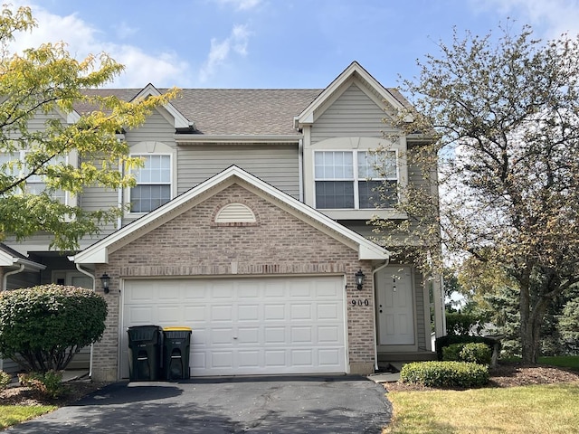 900 Windstone Ct, Lake In The Hills, IL 60156 - traditional-style house featuring driveway, brick siding, and roof with shingles
