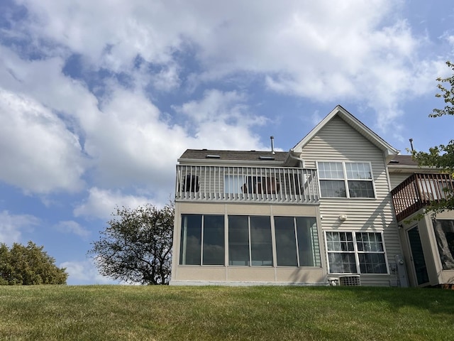 900 Windstone Ct, Lake In The Hills, IL 60156 - back of property featuring a balcony, a yard, and a sunroom