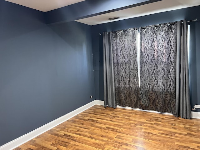 900 Windstone Ct, Lake In The Hills, IL 60156 - empty room featuring wood finished floors and baseboards