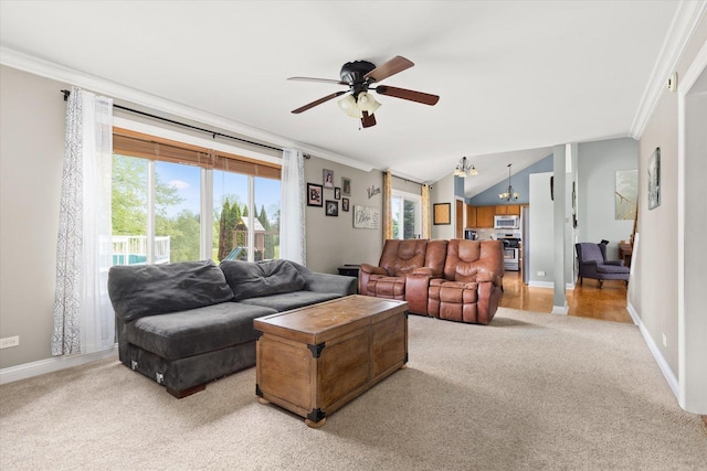25516 W Gateway Cir, Plainfield, IL 60585 - living area featuring light carpet, crown molding, a ceiling fan, baseboards, and a chandelier