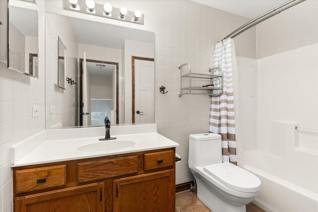 25516 W Gateway Cir, Plainfield, IL 60585 - bathroom featuring tile walls, vanity, shower / bath combination with curtain, toilet, and tile patterned flooring
