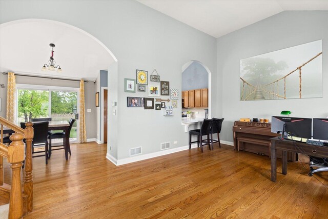 25516 W Gateway Cir, Plainfield, IL 60585 - office with arched walkways, light wood-style flooring, vaulted ceiling, and baseboards