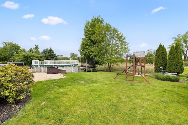 25516 W Gateway Cir, Plainfield, IL 60585 - view of green lawn with a trampoline, a playground, and a patio area