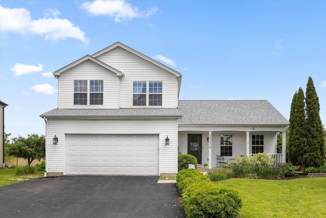 25516 W Gateway Cir, Plainfield, IL 60585 - traditional-style home with asphalt driveway, a garage, a front yard, a porch, and a shingled roof