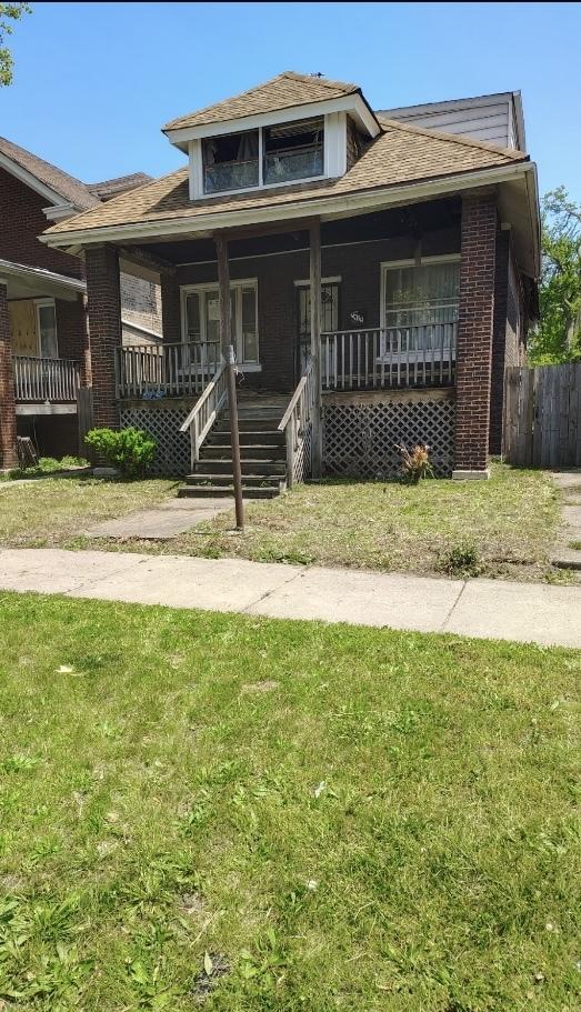 7925 S Ridgeland Ave, Chicago, IL 60617 - bungalow with brick siding and covered porch