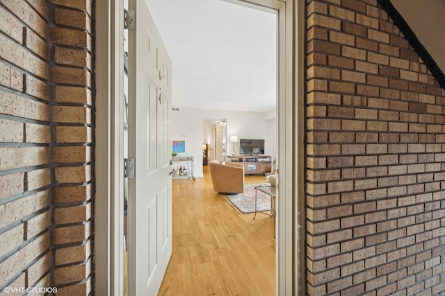 17 N Madison Ave Unit 4, La Grange, IL 60525 - hallway with light wood-type flooring and brick wall
