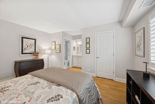 17 N Madison Ave Unit 4, La Grange, IL 60525 - bedroom with light wood finished floors, baseboards, and connected bathroom