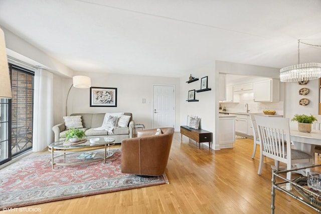 17 N Madison Ave Unit 4, La Grange, IL 60525 - living area featuring light wood finished floors and a chandelier