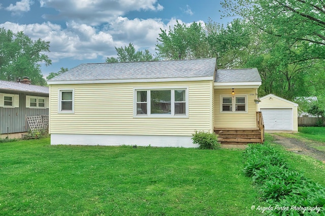 1720 Rogers Ave, Mchenry, IL 60050 - back of house featuring driveway, an outdoor structure, a yard, roof with shingles, and a garage