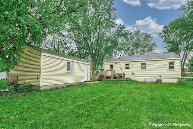 1720 Rogers Ave, Mchenry, IL 60050 - back of property with a lawn and central AC unit