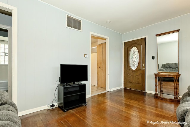 1720 Rogers Ave, Mchenry, IL 60050 - foyer entrance with hardwood / wood-style floors, ornamental molding, and baseboards