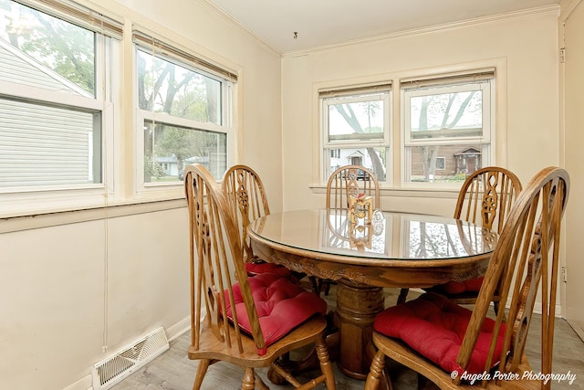 1720 Rogers Ave, Mchenry, IL 60050 - dining space with ornamental molding, light wood-style floors, and baseboards