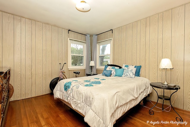 1720 Rogers Ave, Mchenry, IL 60050 - bedroom featuring wood-type flooring and wood walls