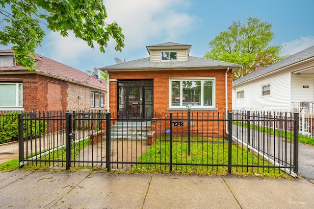 8425 S Essex Ave, Chicago, IL 60617 - view of front of home featuring brick siding, a gate, and covered porch