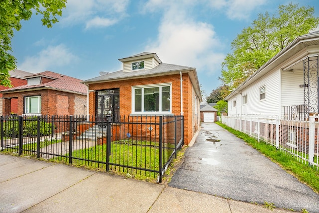 8425 S Essex Ave, Chicago, IL 60617 - view of front of home featuring brick siding and a garage