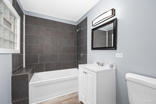 8425 S Essex Ave, Chicago, IL 60617 - bathroom with vanity, bathing tub / shower combination, toilet, and wood finished floors