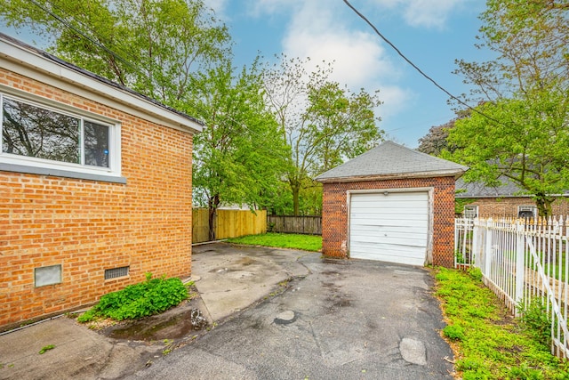 8425 S Essex Ave, Chicago, IL 60617 - detached garage featuring asphalt driveway