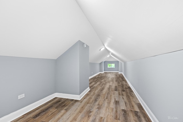 8425 S Essex Ave, Chicago, IL 60617 - bonus room featuring wood finished floors, baseboards, and vaulted ceiling