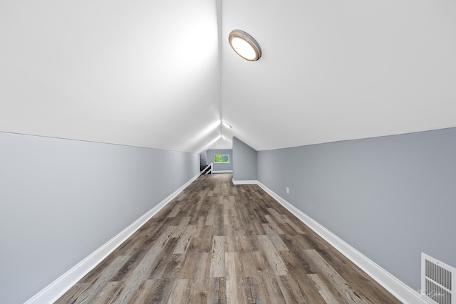 8425 S Essex Ave, Chicago, IL 60617 - bonus room featuring wood finished floors, baseboards, and vaulted ceiling
