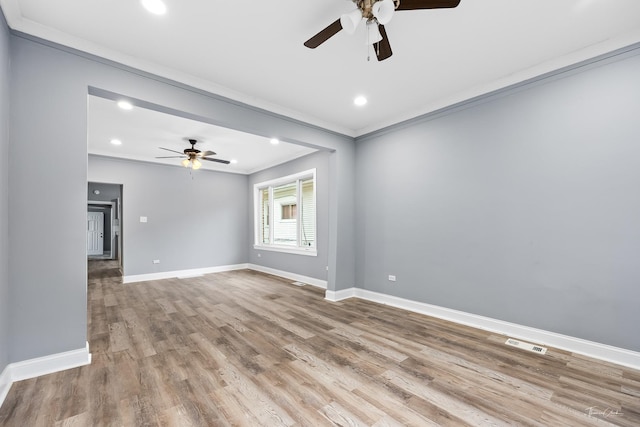 8425 S Essex Ave, Chicago, IL 60617 - spare room featuring a ceiling fan, crown molding, baseboards, wood finished floors, and recessed lighting