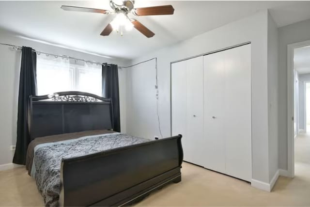 1557 Scottdale Cir, Wheaton, IL 60189 - bedroom with a closet, light colored carpet, multiple windows, and baseboards