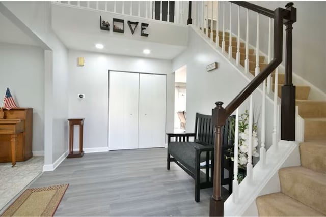 1557 Scottdale Cir, Wheaton, IL 60189 - stairs with a towering ceiling, wood finished floors, baseboards, and recessed lighting