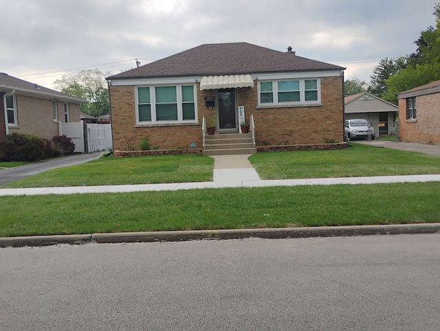 1424 Jerele Ave, Berkeley, IL 60163 - bungalow-style home featuring brick siding, entry steps, a front lawn, and roof with shingles
