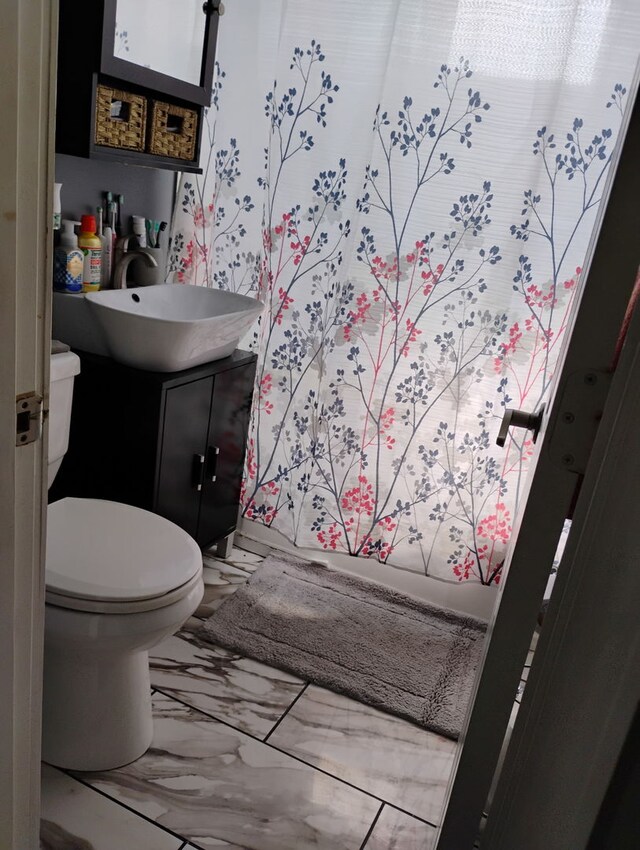 1424 Jerele Ave, Berkeley, IL 60163 - bathroom featuring marble finish floors, toilet, and vanity