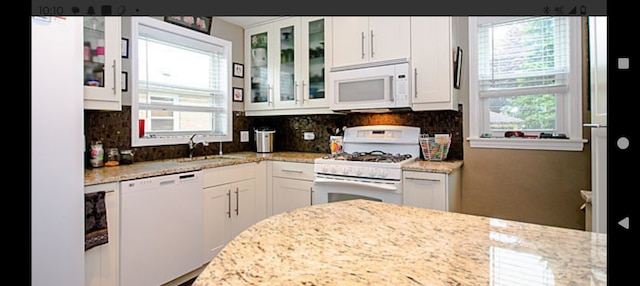 1424 Jerele Ave, Berkeley, IL 60163 - kitchen with white appliances, healthy amount of natural light, a sink, and white cabinets