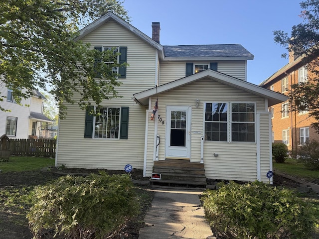 705 Campbell St, Joliet, IL 60435 - traditional-style home featuring entry steps and a chimney