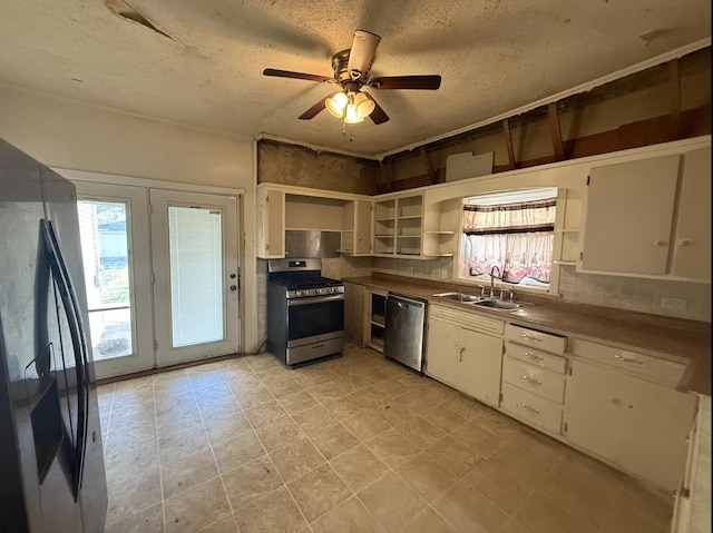705 Campbell St, Joliet, IL 60435 - kitchen featuring appliances with stainless steel finishes, open shelves, a sink, plenty of natural light, and a textured ceiling