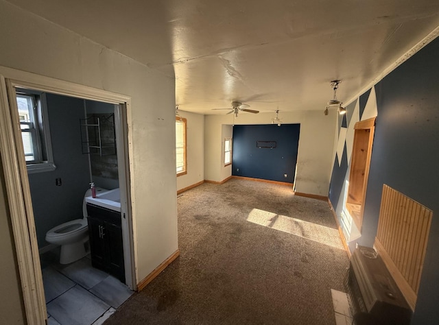 705 Campbell St, Joliet, IL 60435 - hallway with plenty of natural light, light carpet, and baseboards